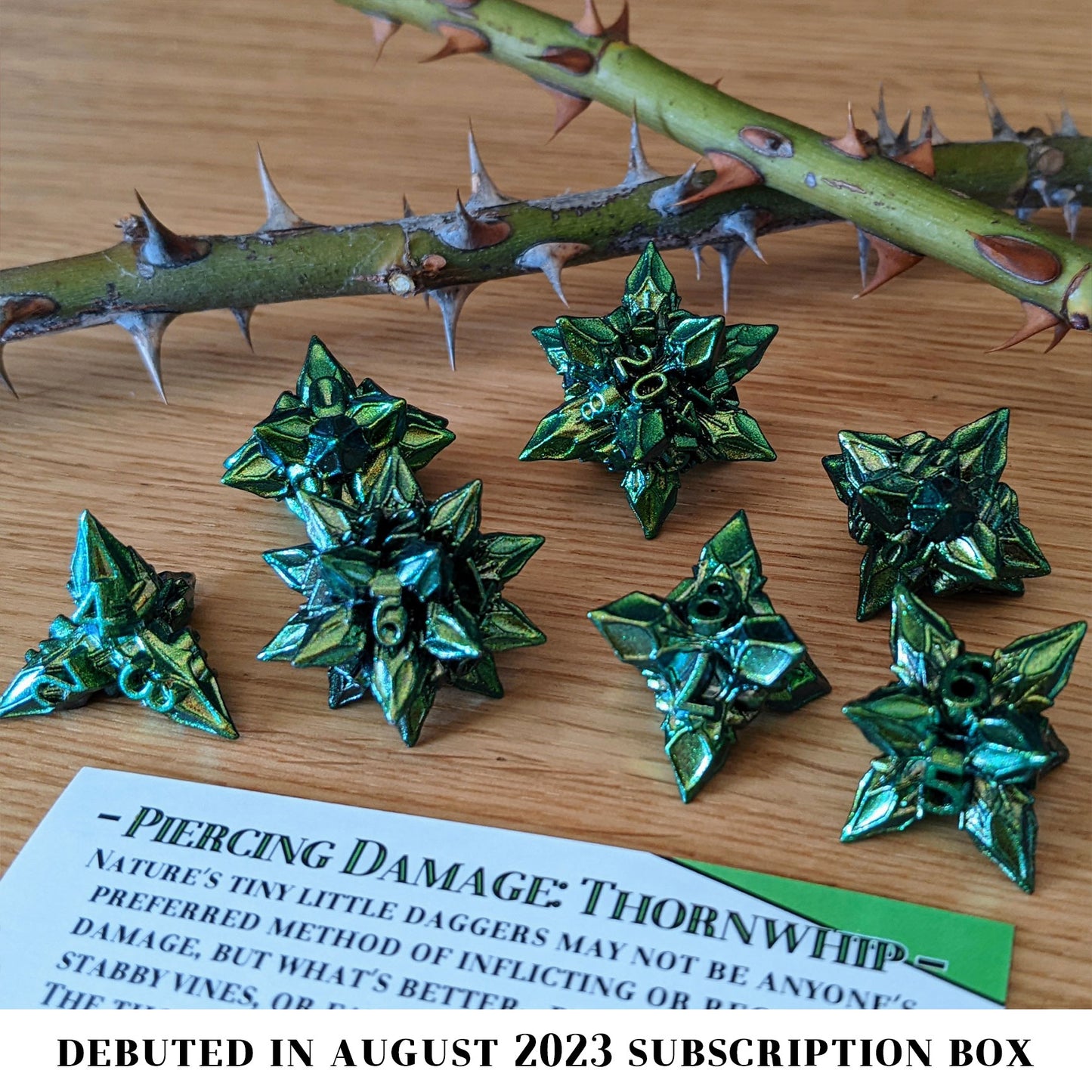 Thorn Whip is a 7-piece set of green and gold color-shifting, extraordinarily pointy metal dice. Roll with care.