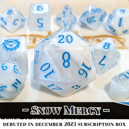 Snow Mercy is a 10-piece set of clear resin dice with swirls of frosty white, inked in blue.