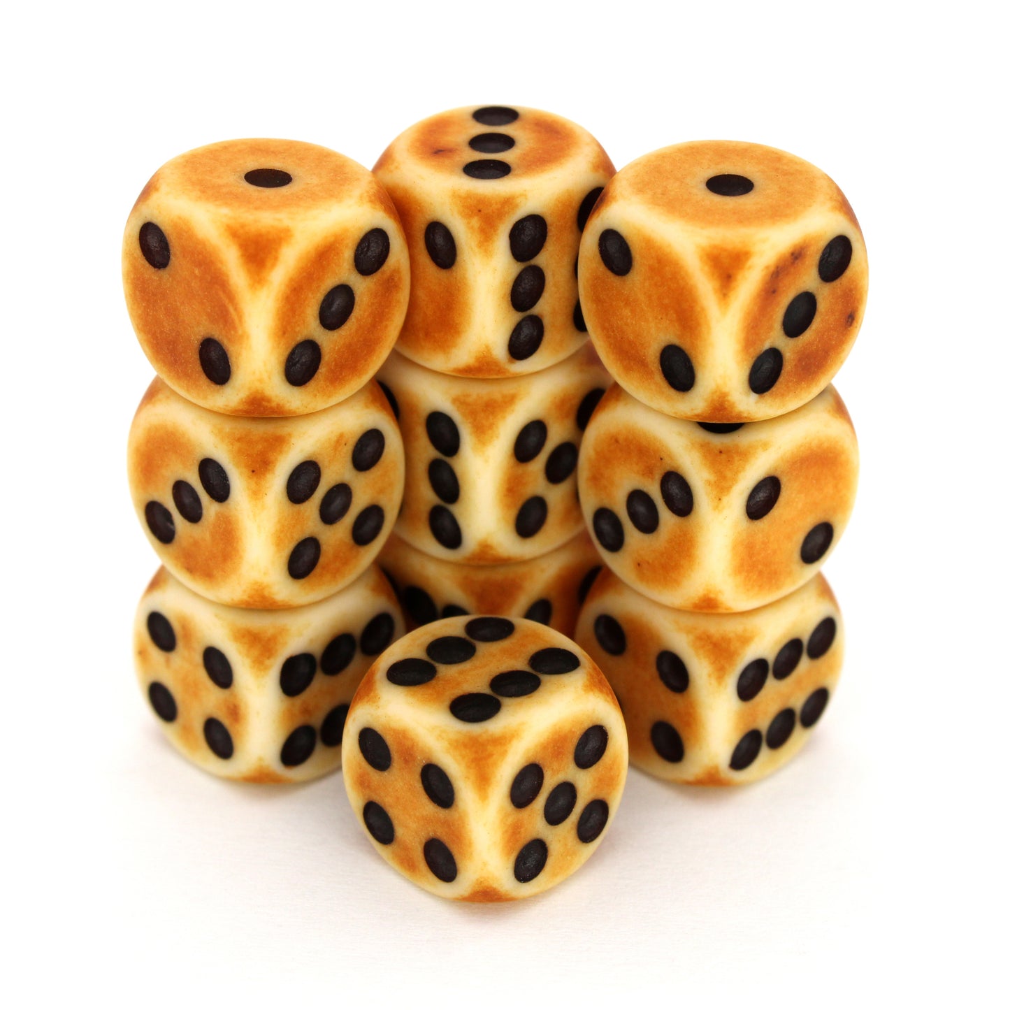 Dragon Bone is a 10-piece set of matte bone-colored 12mm d6s, with a dark patina, and pips inked in black. They are part of our Pip-Squeaks collection.