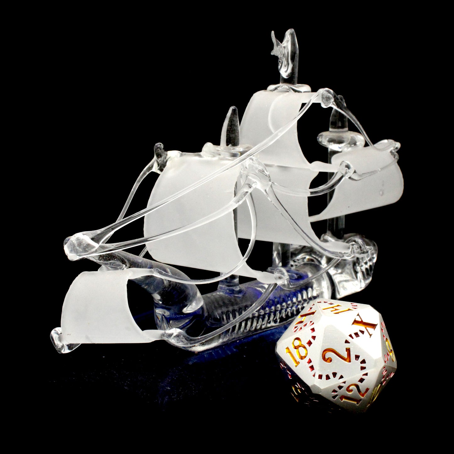 Jolly Roger is a Dice Envy Exclusive 8-piece set of silver metal dice with a treasure map engraving inked in red and gold. It is part of the Pirate Dice collection.