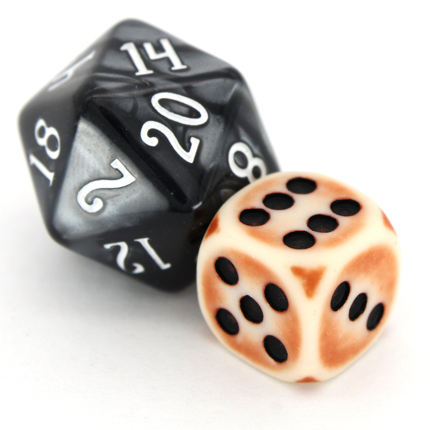 Rust Antennae is a 10-piece set of matte pale-colored 12mm d6s, with a rust patina, and pips inked in black.