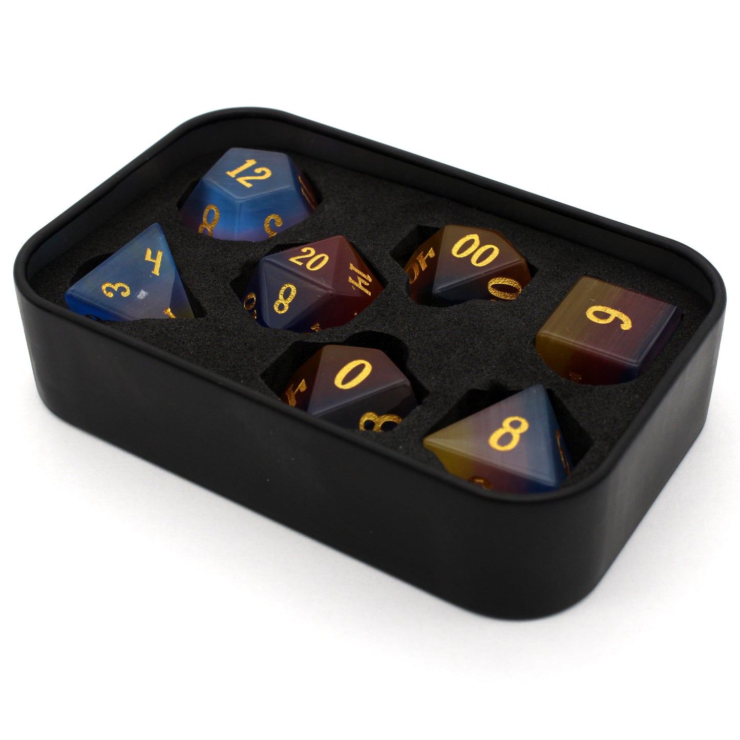 Sparkle Horse is a 7-piece set of blue, yellow, and pink glass dice with gold inked numbering.