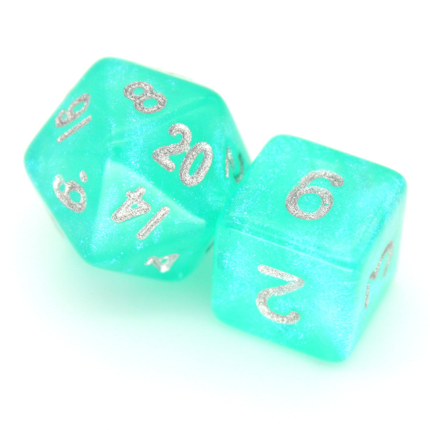 Cyantidote is a 7-piece 13mm semi-translucent glittery aqua resin dice set, inked in silver. It belongs to our tiny but mighty Wee Lads collection.