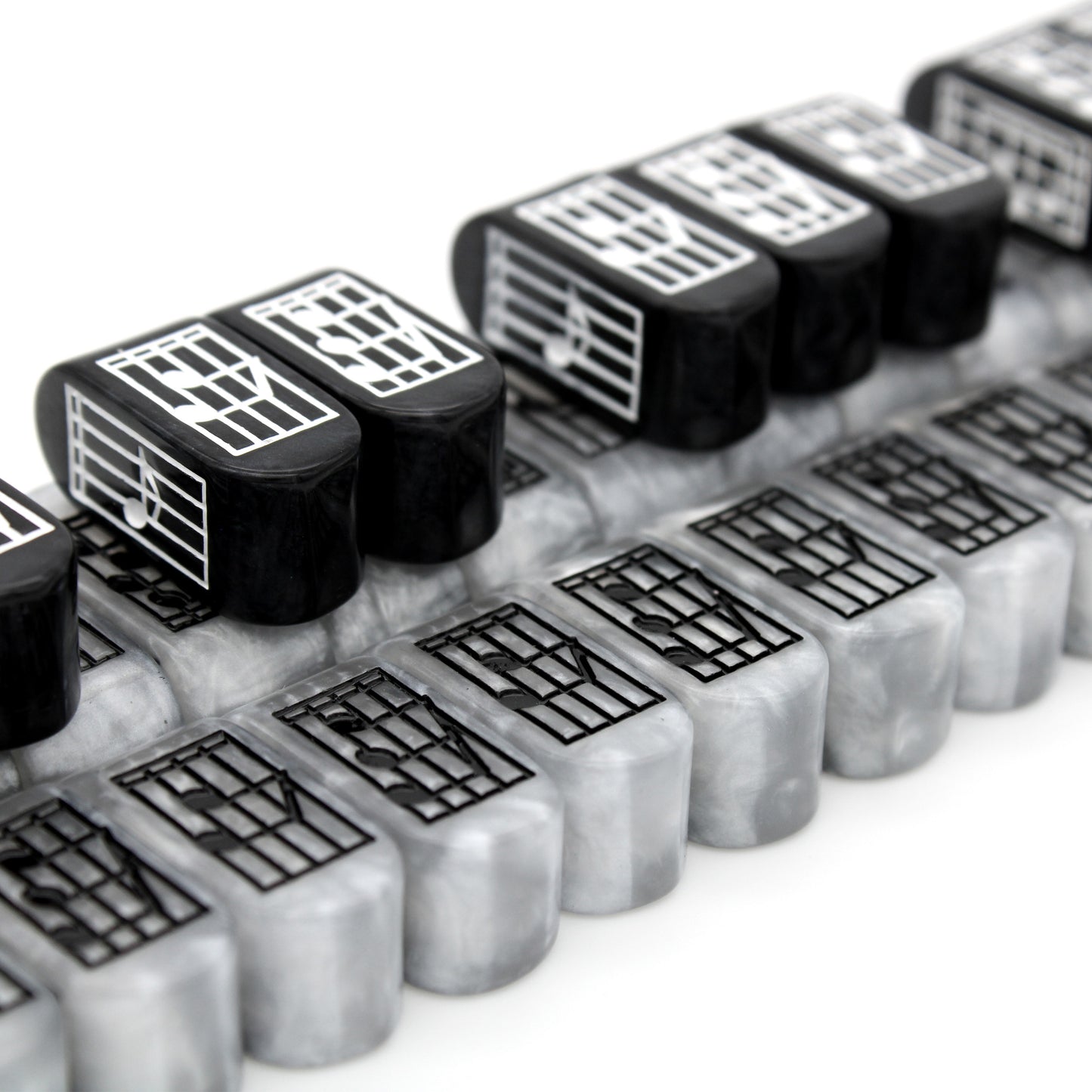 Bright and cheerful, Prelude Infinity d4s D4s are a silvery tone and feature black music notes supported on a black staff.