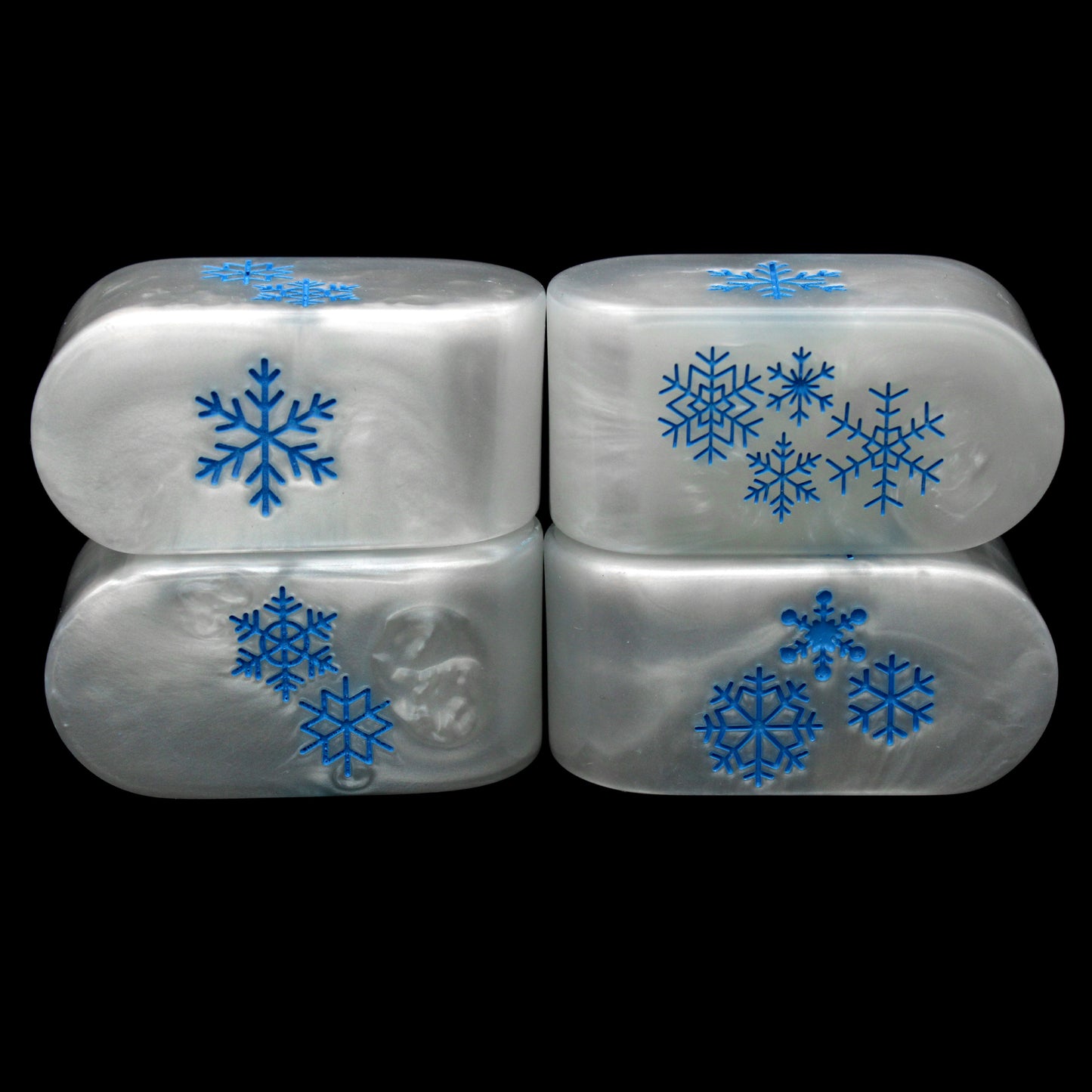 Snowfall Chonkfinity d4s are made of chilly marbled white resin and feature ice blue snowflakes on each side.