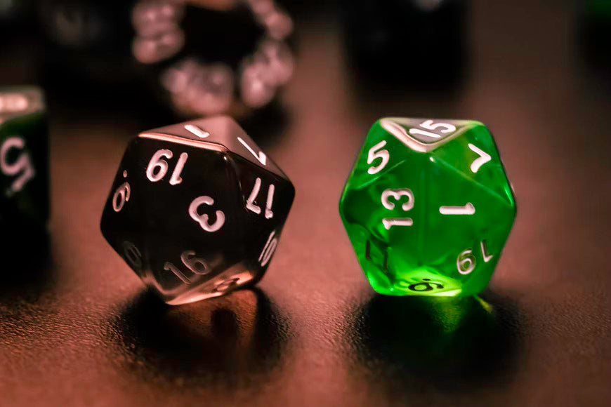black and green dice on a table