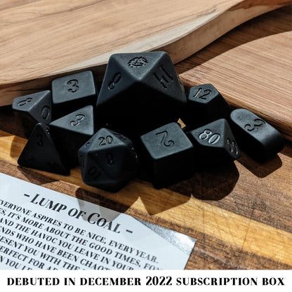 Lump of Coal is a 10-piece set of matte black resin dice.