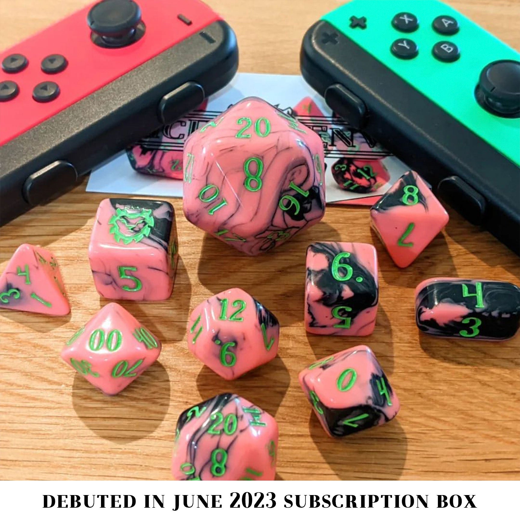 Arcade Bar is a 10-piece set of pink resin dice swirled with black and inked in neon green.
