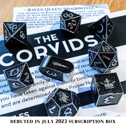 Shadowfell is an 8-piece Dice Envy exclusive set of silver metal dice in our Raven Queen mold, cloaked in shadowy black ink.