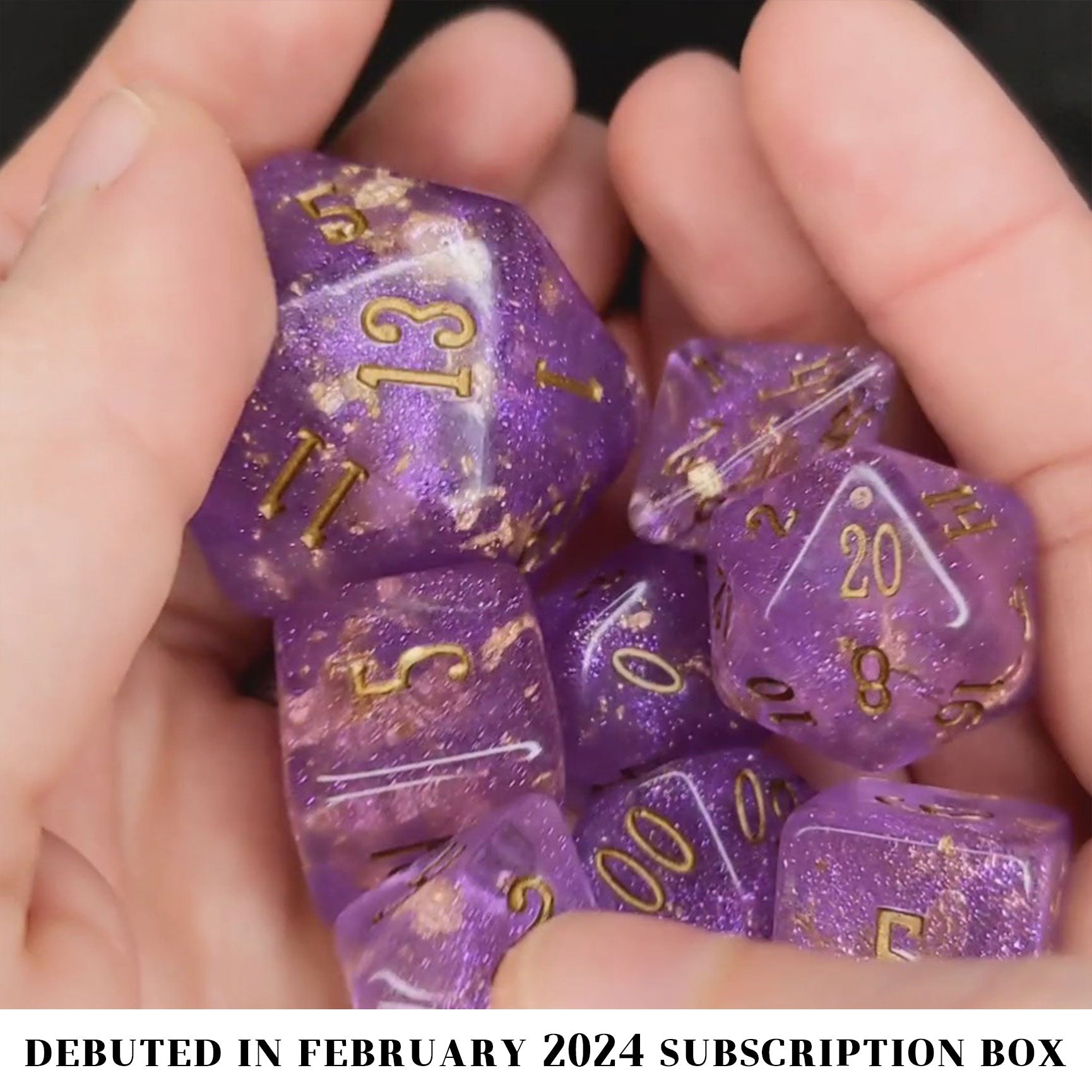 Wizard's Weave is a 10-piece set of translucent, glittery, purple resin dice sprinkled with gold foil and inked in bronze.