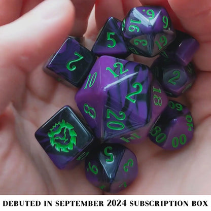 Strange and Unusual is a 10-piece set of black and purple acrylic dice, inked in bug guts green.