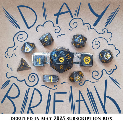 Daybreak is a 10-piece set of shimmering, silvery, grey acrylic dice, inked in gold.