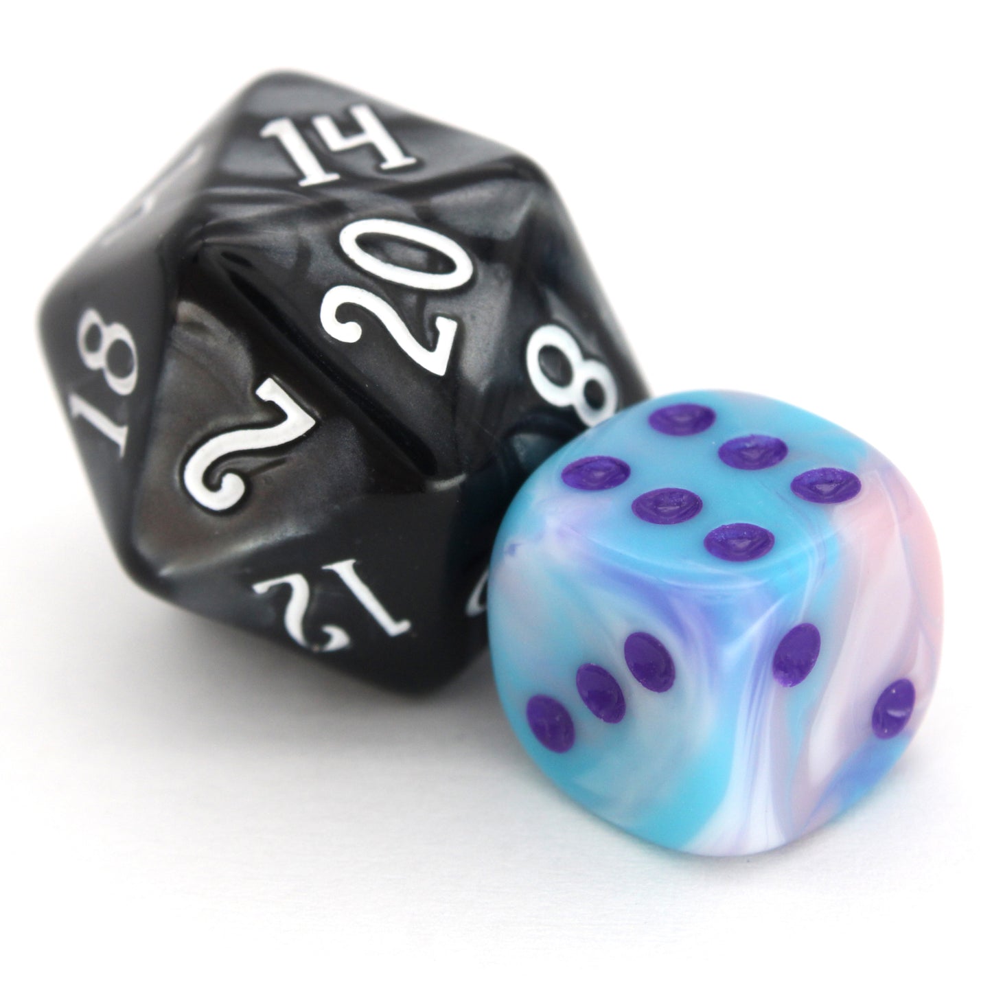 Accursed Confections is a 10-piece set of swirled acrylic 12mm d6 in sugary blue, pink, purple, and white with dark purple ink.