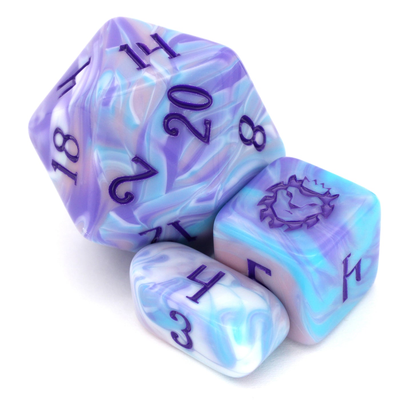 Accursed Confections is a 10-piece set of swirled acrylic dice in sugary blue, pink, purple, and white with dark purple ink.