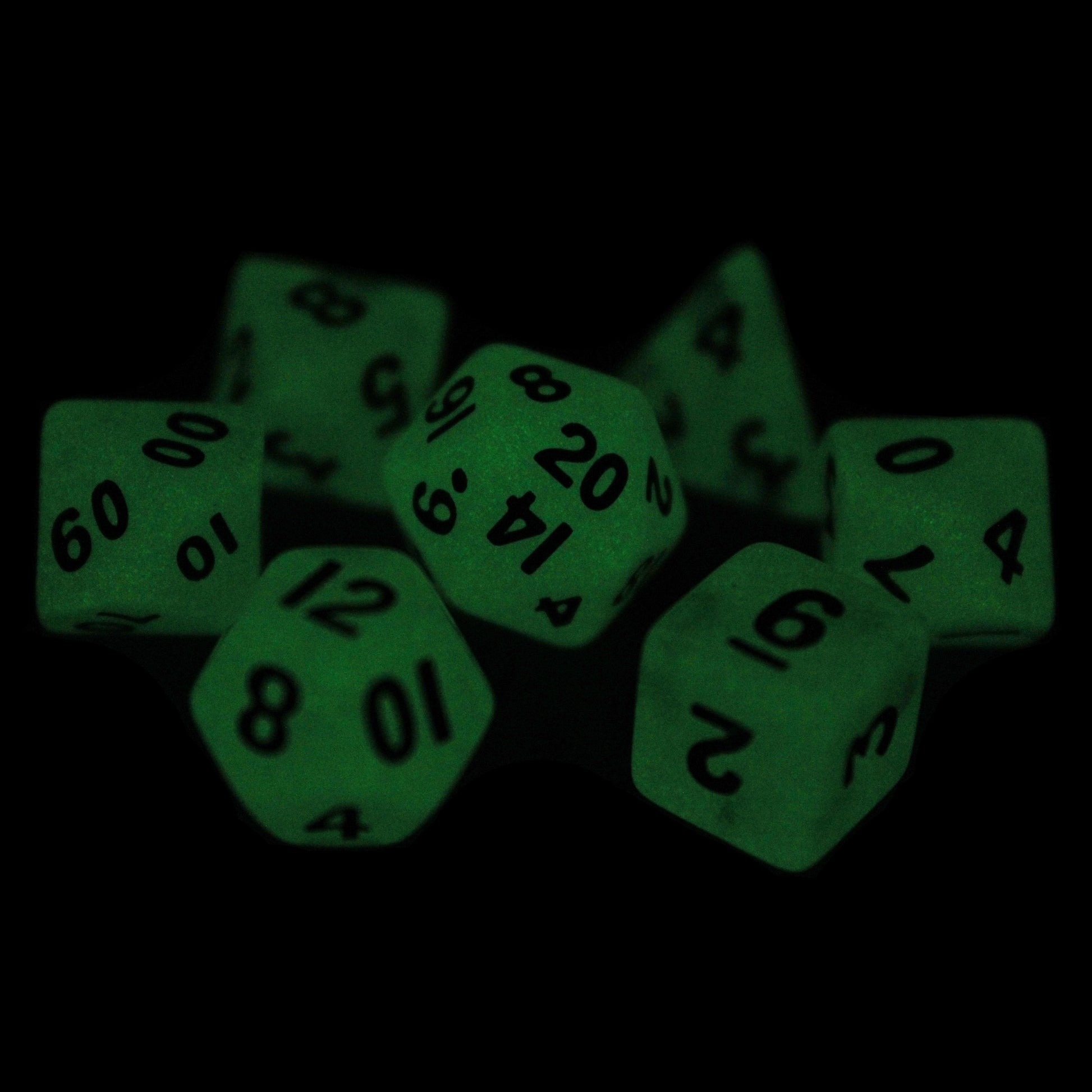Acid Rain is a 7-piece 13mm semi-opaque resin dice set, inked in black.