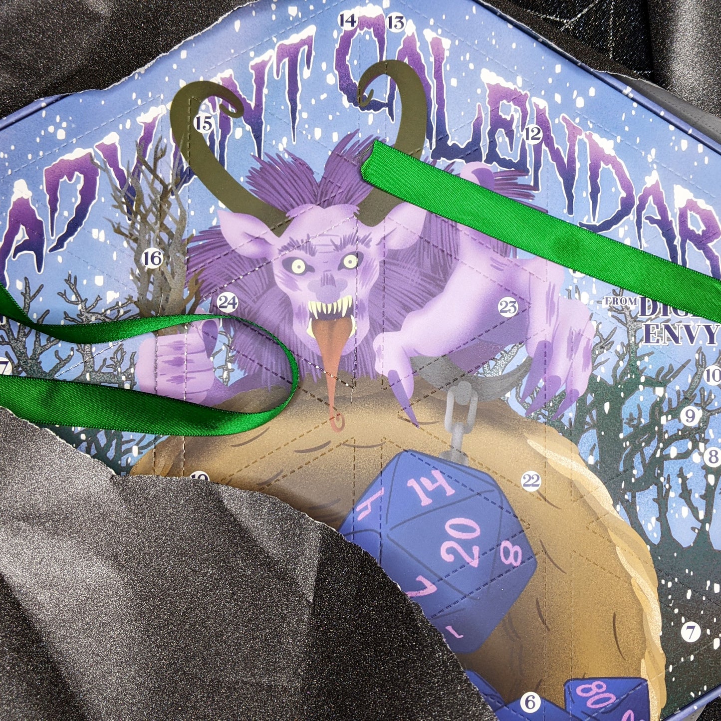 Each Dice Envy Advent Calendar is a 14" wide perforated calendar with over 30 exclusive TTRPG dice, including full sets and single dice! There are two calendar variations for 2025, and each variation contains the same dice, so if you get two they will match. The perfect gift for the dice goblin in your life! Does not include trees or snowmen.