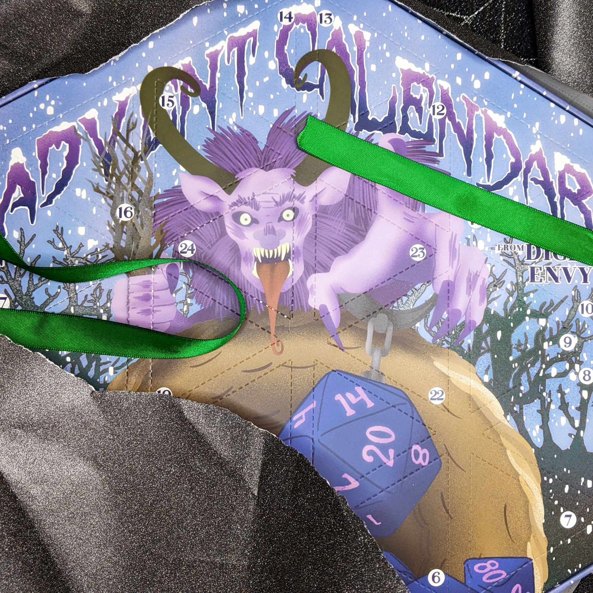 Each Dice Envy Advent Calendar is a 14" wide perforated calendar with over 30 exclusive TTRPG dice, including full sets and single dice! There are two calendar variations for 2025, and each variation contains the same dice, so if you get two they will match. The perfect gift for the dice goblin in your life! Does not include trees or snowmen.