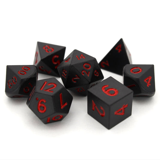 Bloodsuckers is a 7-piece set of matte, black colored 10mm metal dice with bright red inking.