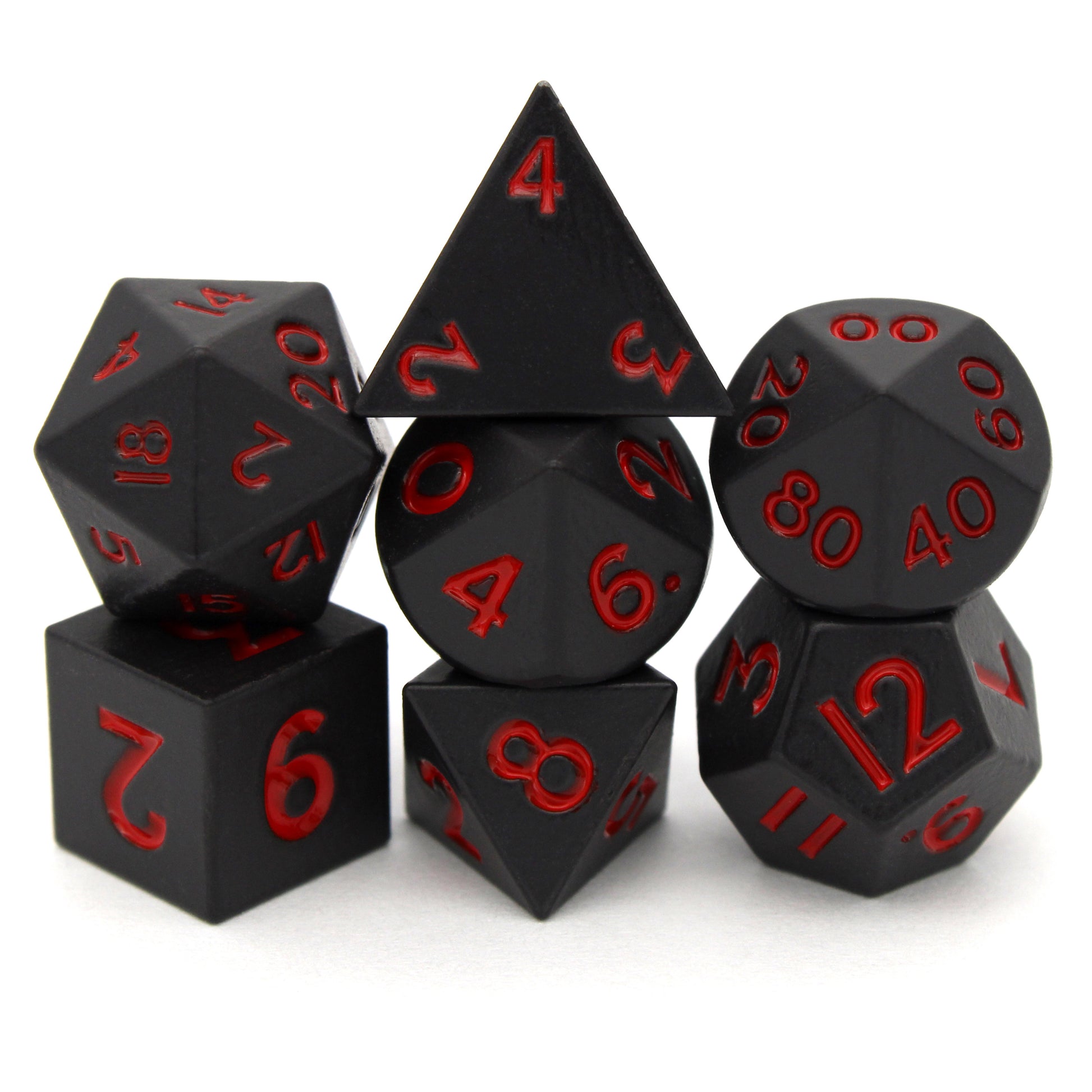 Bloodsuckers is a 7-piece set of matte, black colored 10mm metal dice with bright red inking.
