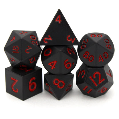 Bloodsuckers is a 7-piece set of matte, black colored 10mm metal dice with bright red inking.