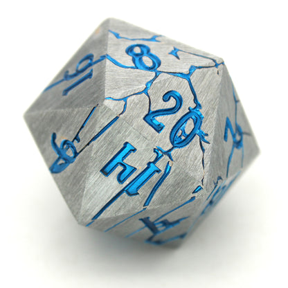 Cania Corrosion is an 8-piece set of silver dice, cracking to show depths and numbers of a shimmering metallic blue.