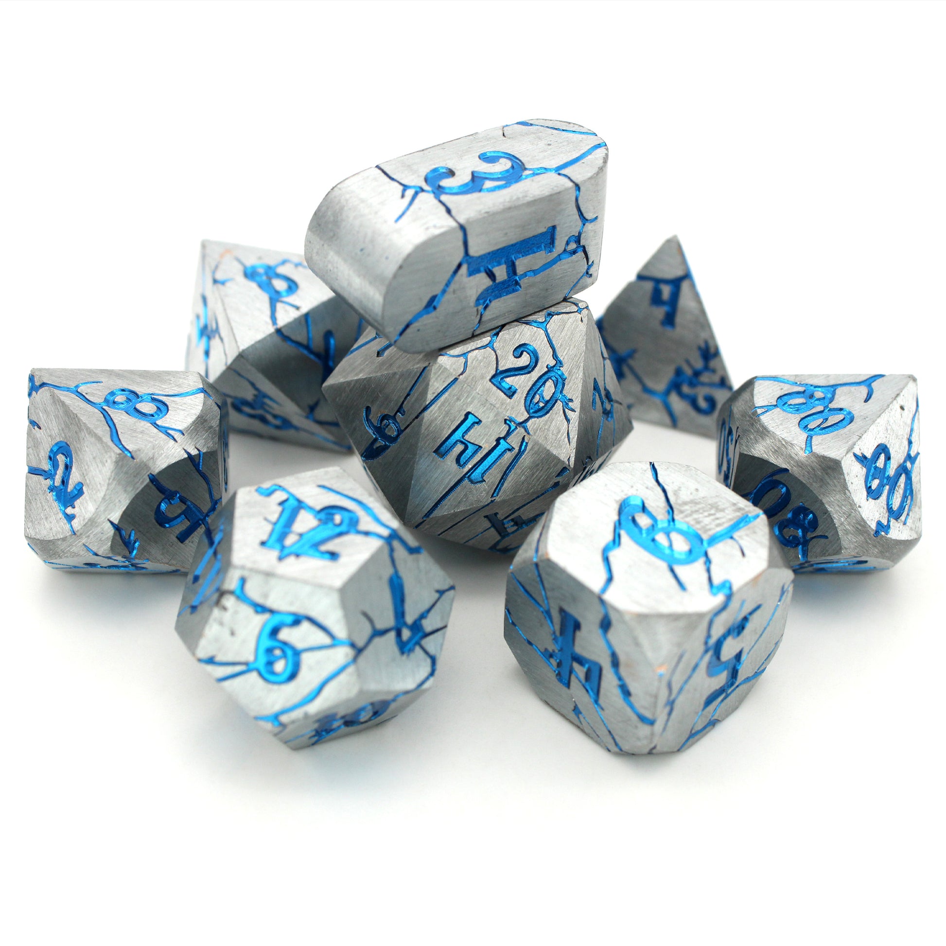 Cania Corrosion is an 8-piece set of silver dice, cracking to show depths and numbers of a shimmering metallic blue.