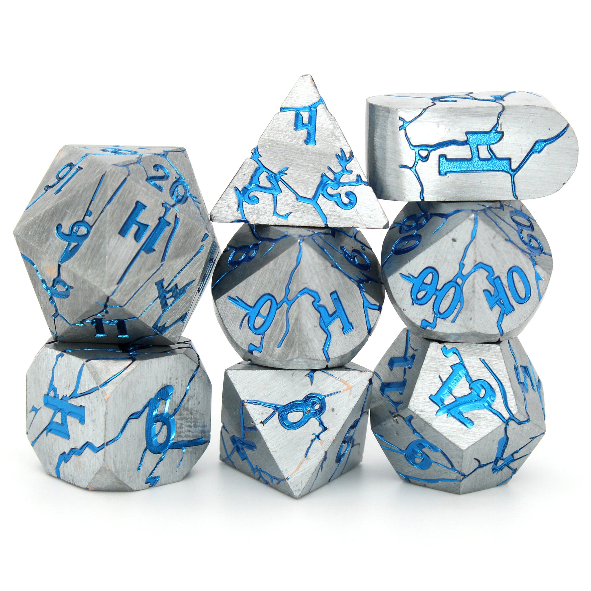 Cania Corrosion is an 8-piece set of silver dice, cracking to show depths and numbers of a shimmering metallic blue.