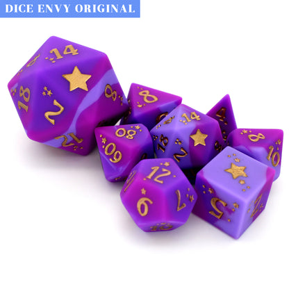 Chaotic Good is an 8-piece, swirled silicone dice set in noble pinks and purples. It features a starry-eyed, gold ink design.