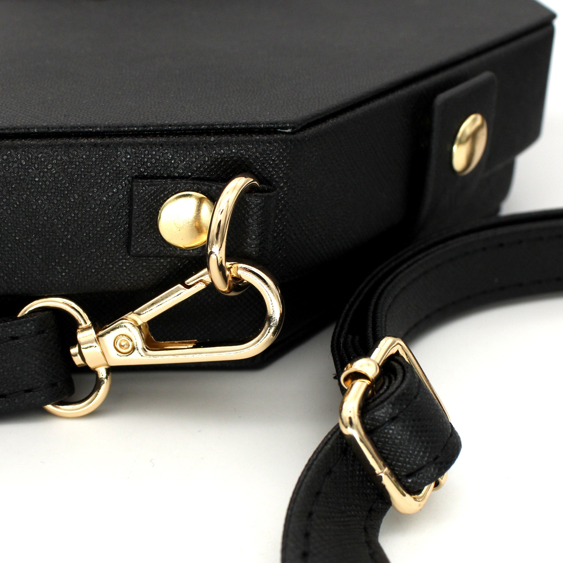 Made of black vegan leather and velvet, our Crossbody Dice Trays are deep enough to hold our Chonky d20s and have a removable strap that adjusts from 38" to 70" long.