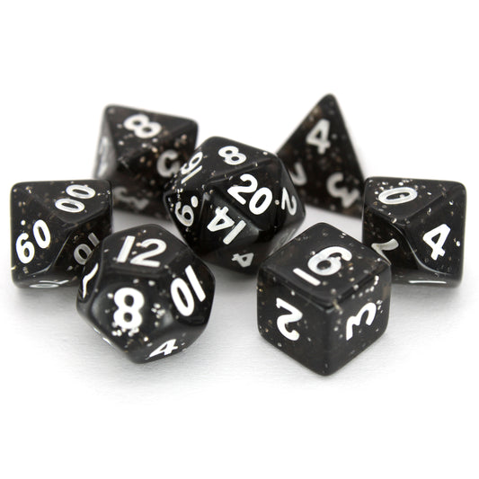 D'vination is a 7-piece 13mm resin dice set in transparent black with silver glitter, inked in white.
