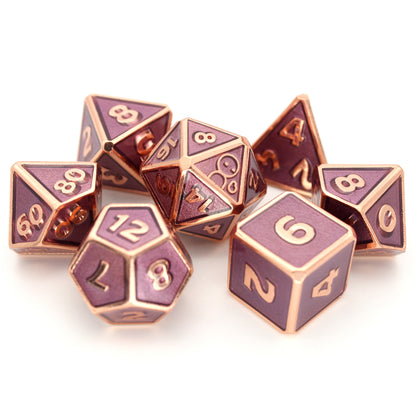 Dabarella is a 7-piece rose gold, framed metal set filled with a rich, mauve enamel, which comes in a collectible Adventure is Nigh branded dice wallet. It is part of the Adventure Is Nigh collection.
