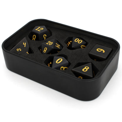 Dark Night is a 7-piece set of black, cat's eye glass dice with gold numbering.
