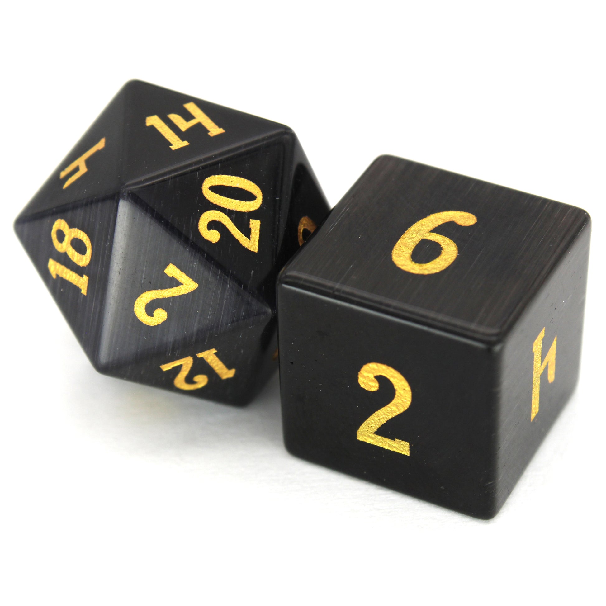 Dark Night is a 7-piece set of black, cat's eye glass dice with gold numbering.