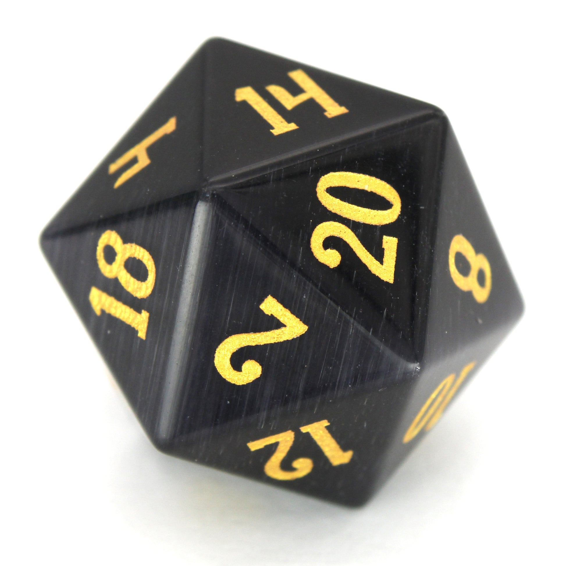 Dark Night is a 7-piece set of black, cat's eye glass dice with gold numbering.