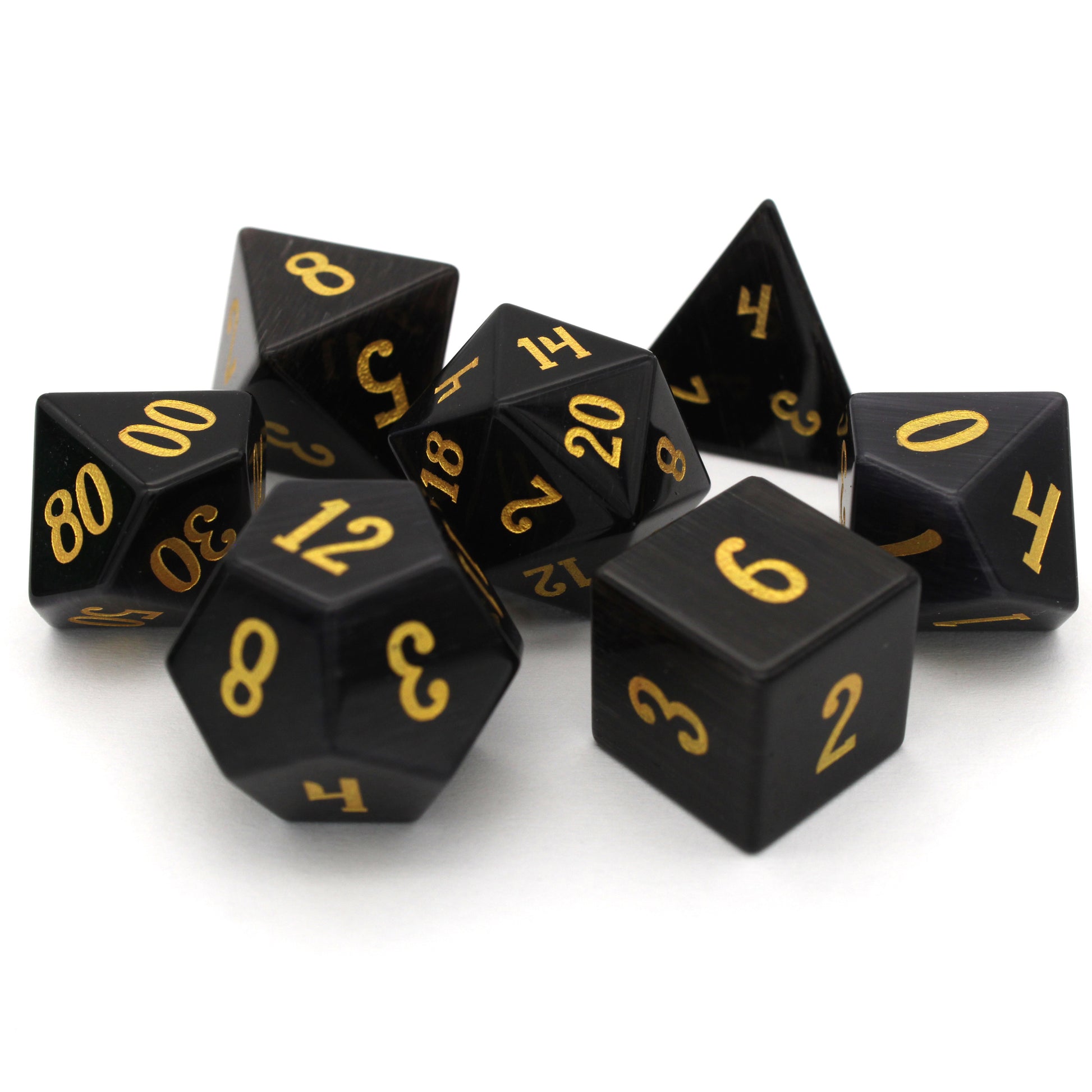 Dark Night is a 7-piece set of black, cat's eye glass dice with gold numbering.