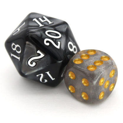 Daybreak is a 10-piece set of shimmering slivery-grey 12mm d6s, with pips inked in gold. They are part of our&nbsp;Pip-Squeaks collection.