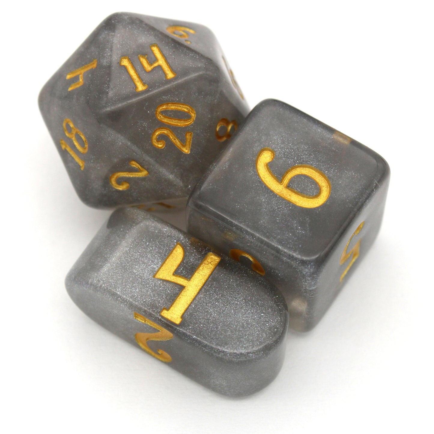 Daybreak is a 10-piece set of shimmering, silvery, grey acrylic dice, inked in gold.