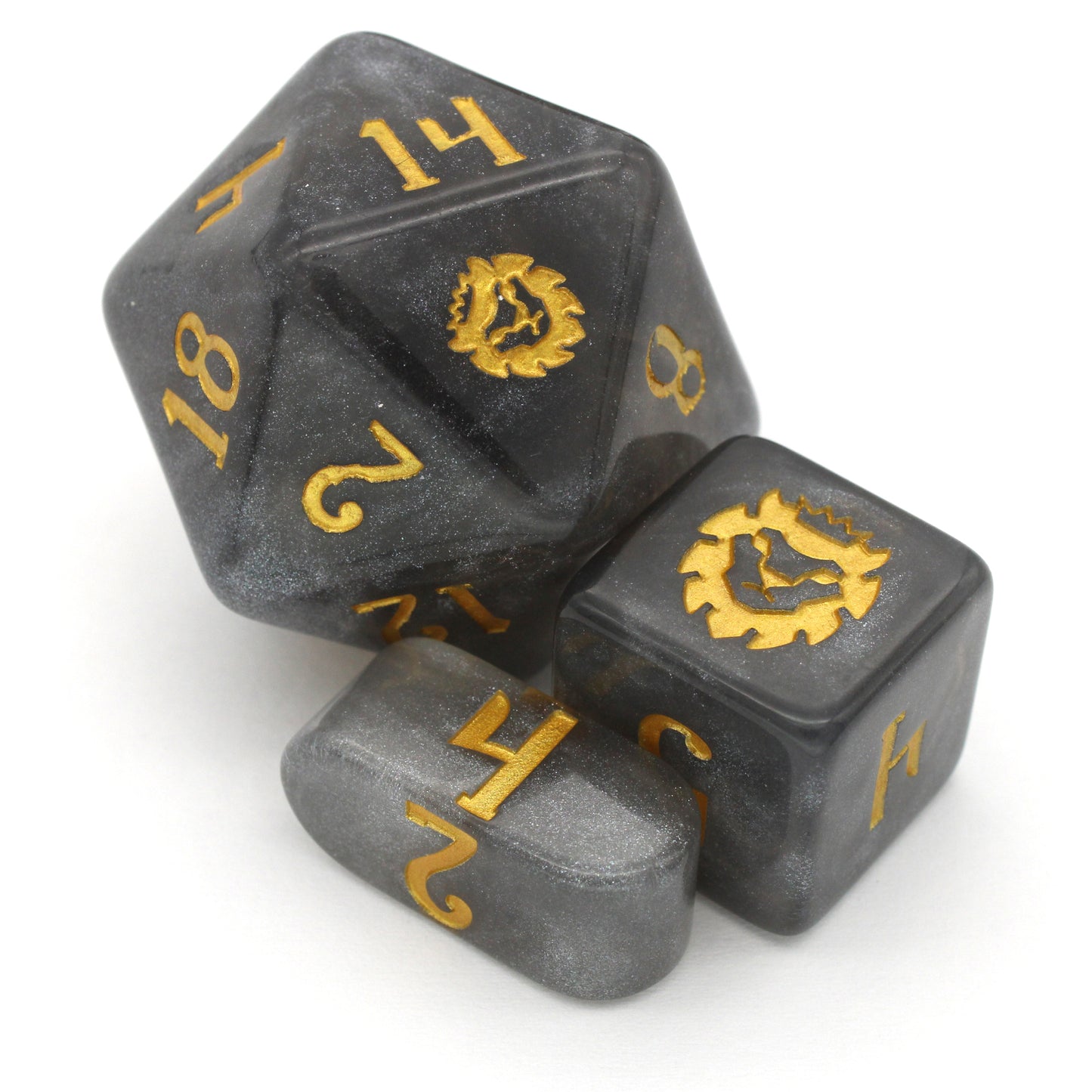 Daybreak is a 10-piece set of shimmering, silvery, grey acrylic dice, inked in gold.