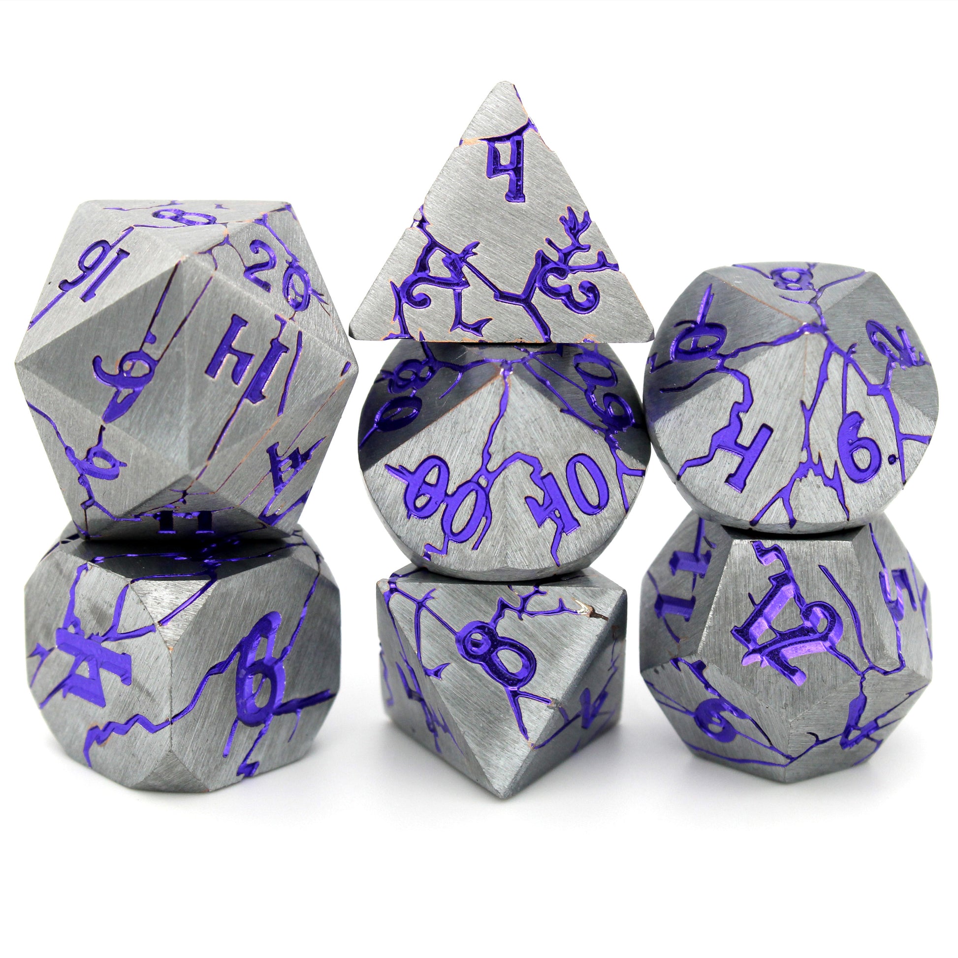 Dis Delights is a 7-piece set of silver dice, with lines and numbers of gleaming metallic purple.