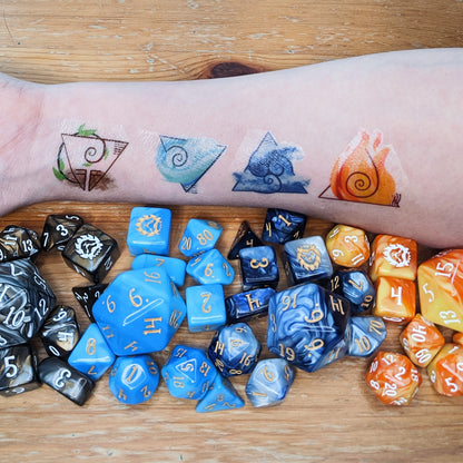 The Elemental Adept Bundle comes with four 10-piece Signature sets: FIREBALL, Shape Water, Air Apparent, and Earthquake, plus a temporary tattoo so you can show off your bending skills!