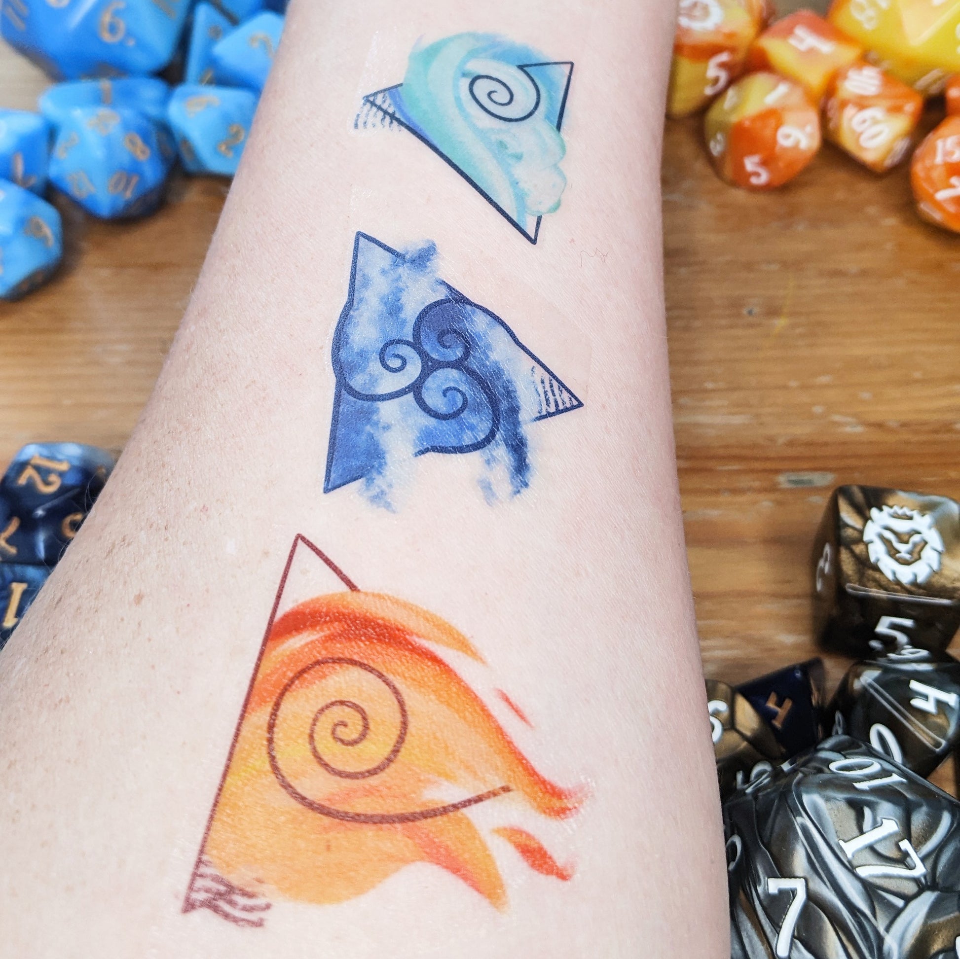 The Elemental Adept Bundle comes with four 10-piece Signature sets: FIREBALL, Shape Water, Air Apparent, and Earthquake, plus a temporary tattoo so you can show off your bending skills!