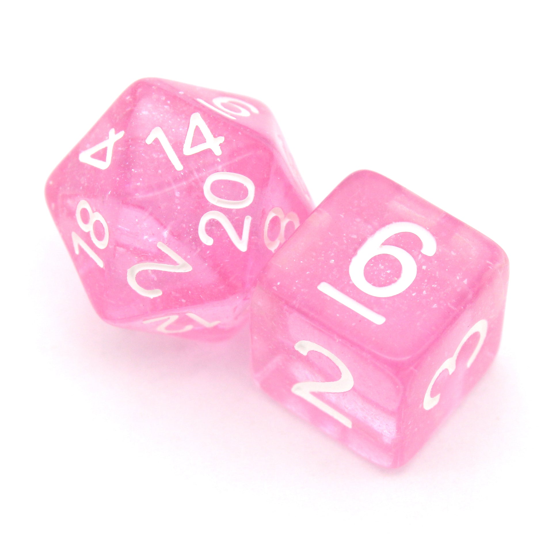 Fairy Dust is a 7-piece, 13mm polymer set of transparent pink resin dice, shimmering with silvery glitter and inked in bright white. It belongs to our tiny but mighty Wee Lads collection.