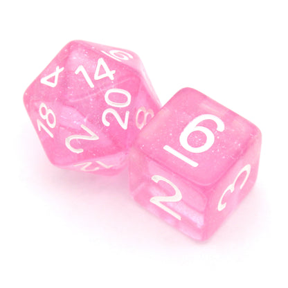 Fairy Dust is a 7-piece, 13mm polymer set of transparent pink resin dice, shimmering with silvery glitter and inked in bright white. It belongs to our tiny but mighty Wee Lads collection.