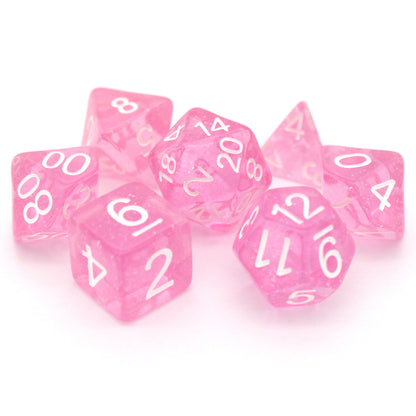 Fairy Dust is a 7-piece, 13mm polymer set of transparent pink resin dice, shimmering with silvery glitter and inked in bright white. It belongs to our tiny but mighty Wee Lads collection.