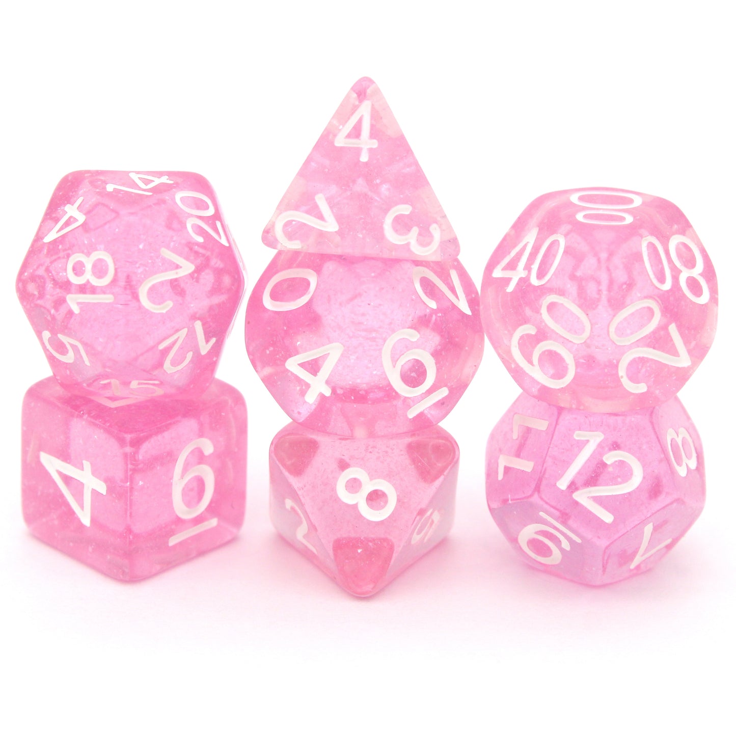 Fairy Dust is a 7-piece, 13mm polymer set of transparent pink resin dice, shimmering with silvery glitter and inked in bright white. It belongs to our tiny but mighty Wee Lads collection.