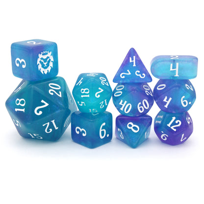 Favored Anemone is a 10-piece set of ocean blue resin dice with a splash of shimmering purple, inked in white.