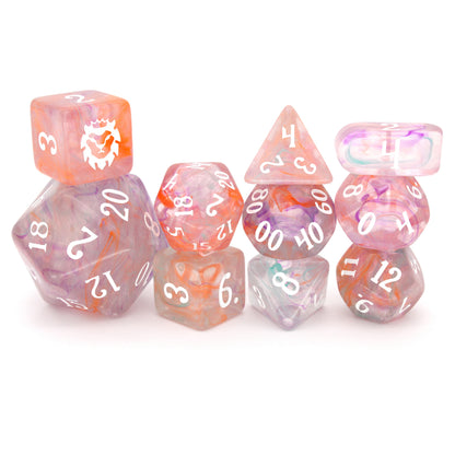 Feywild Fever is a 10-piece translucent acrylic set filled with senseless swirls of pink, orange, blue, and purple - inked in maddening white.