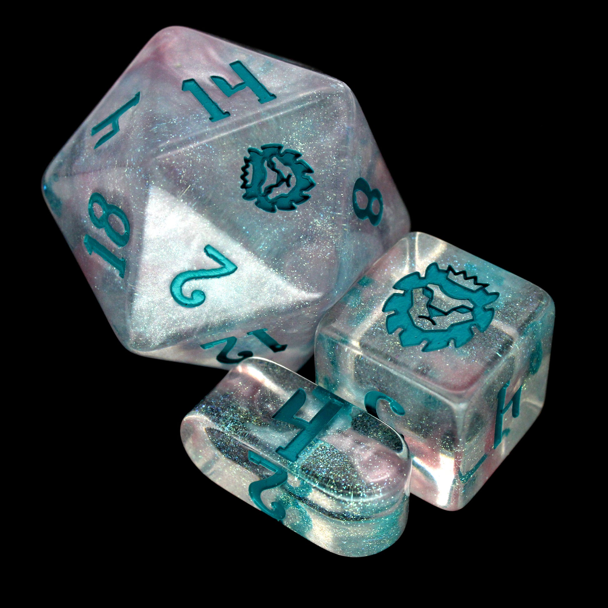 Fifolet is a 10-piece, clear acrylic set with green, iridescent micro-glitter and a rare pearlescent wisp of silvery swirl. The teal ink gives the set an otherworldly aura perfect for any ethereal character at your TTRPG table.