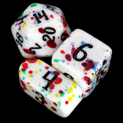 Gobbostopper is a 10-piece white acrylic set with black ink and red, blue, yellow, and green splatters. Please do not eat the dice, goblin or not!