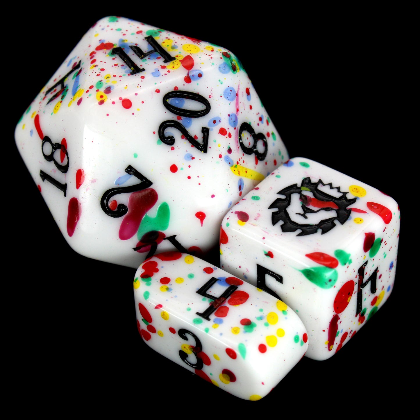 Gobbostopper is a 10-piece white acrylic set with black ink and red, blue, yellow, and green splatters. Please do not eat the dice, goblin or not!